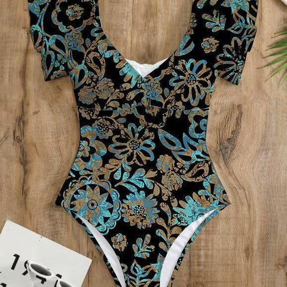 Dame One-piece badedragt med blomster detaljer og dyb V-hals Stilla