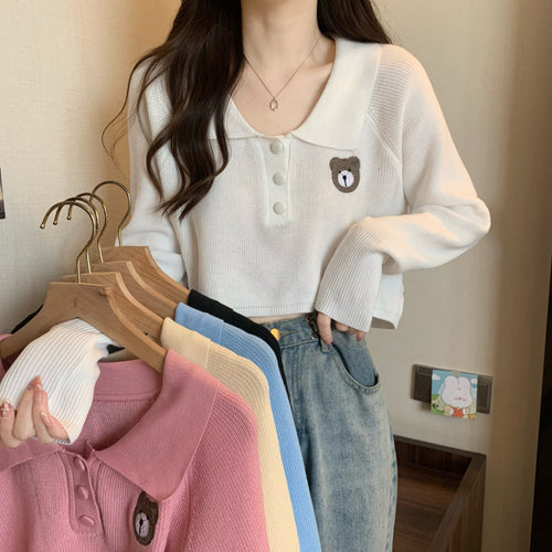 Kvinder Cropped Pullover med en knaplukning og unicorn emblem
