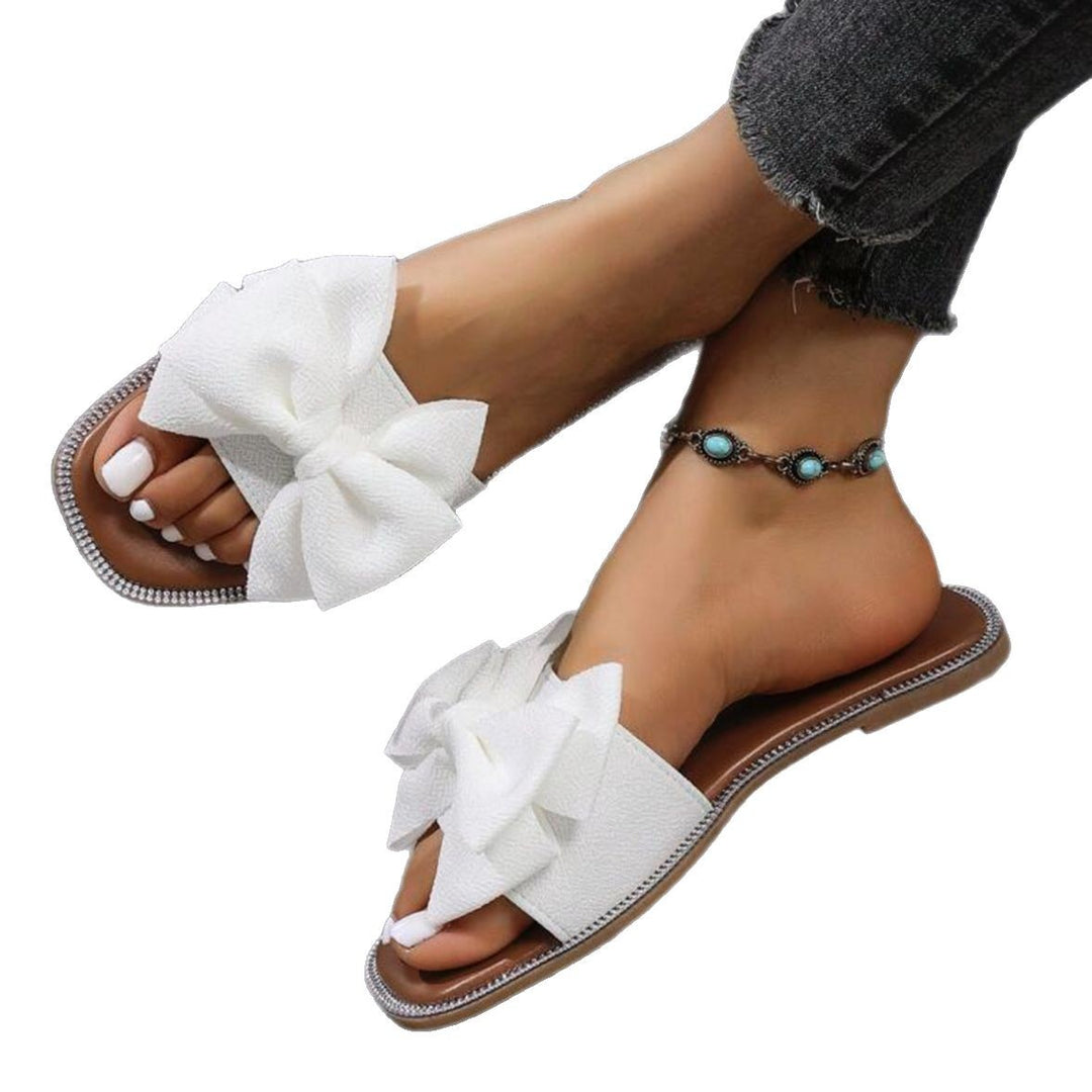 Dame mode slippers med iøjnefaldende sløjfe-design og elegante accenter Stilla