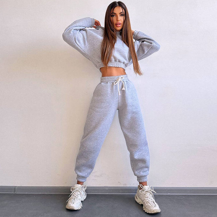 Kvinders sporty cropped sweat sæt med elastisk talje og praktiske lommer