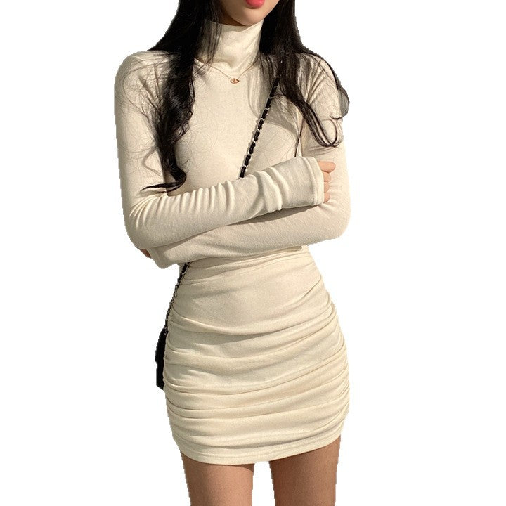 Kvindernes langærmede turtleneck top med elegant samlingseffekt og blødt materiale