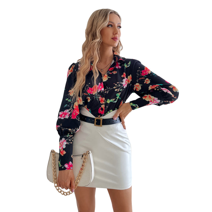 Kvindernes elegante bluse med blomster mønstre og pufærmer Stilla
