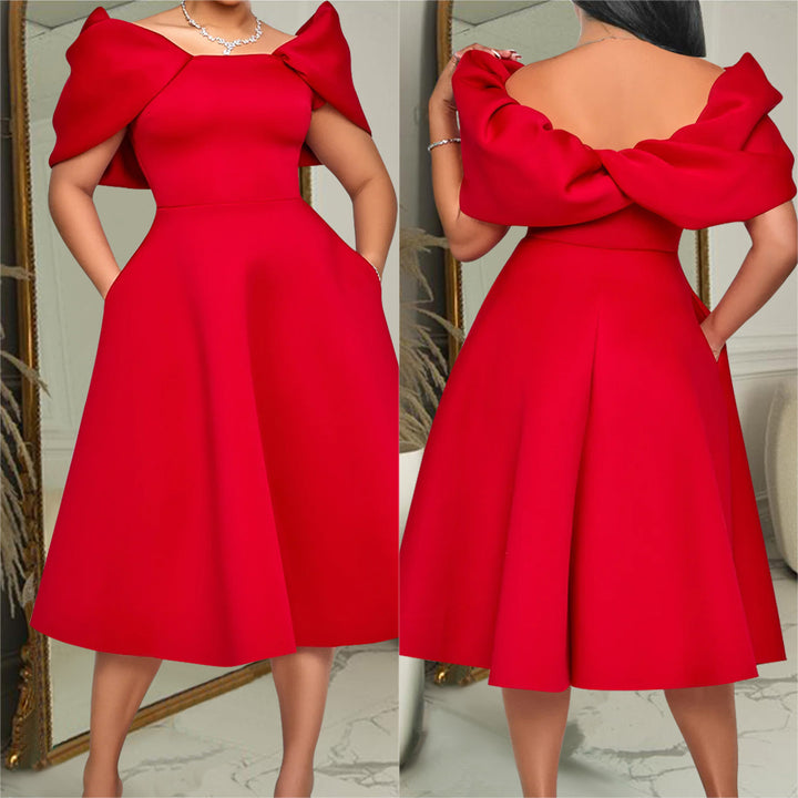 Damer glamourøst midikjole med off-shoulder design og voluminøse puffærmer Stilla