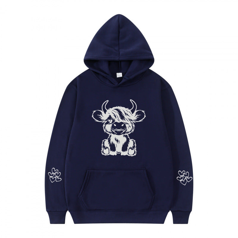 Kvindernes hætte sweatshirt med charmerende kvægmotiv og praktiske kængurulommer Skovae