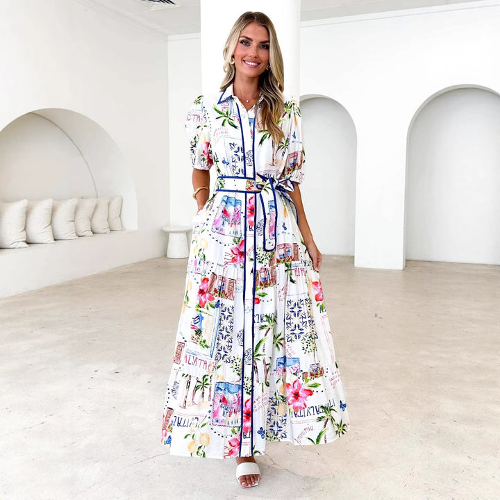Dame maxikjole med farverig blomsterprint og et elegant bælte Stilla