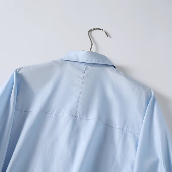 Dame elegant langærmet bluse med moderne detaljer og struktureret stof Skovae