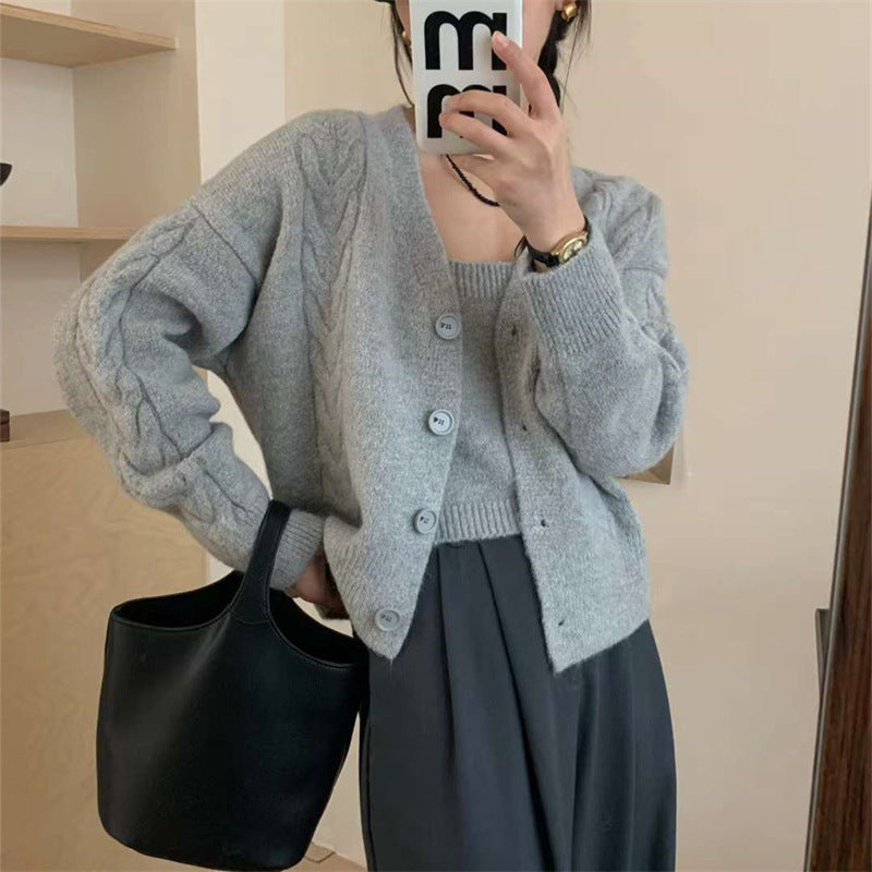 Kvinders cardigan med charmerende kabelmønster og knapdetaljer Stilla