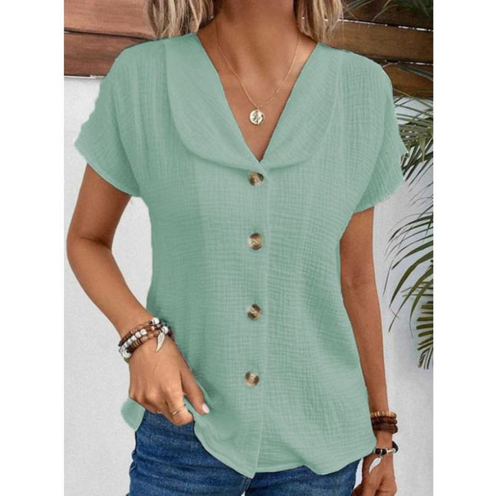 Damebluse med synlige knapper lavet af let stof Stilla