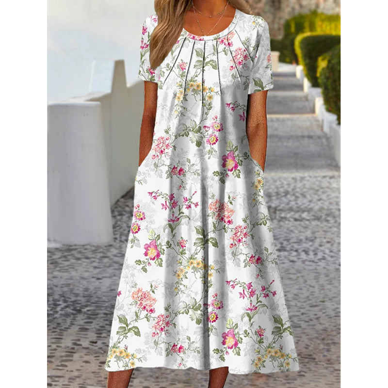 Dame sommerligt maxikjole med blomstret design og praktiske lommer Stilla