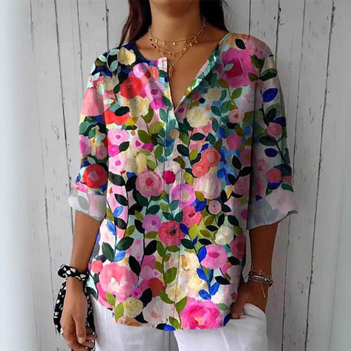 Damebluse med blomsterdesign og knaplukning Stilla