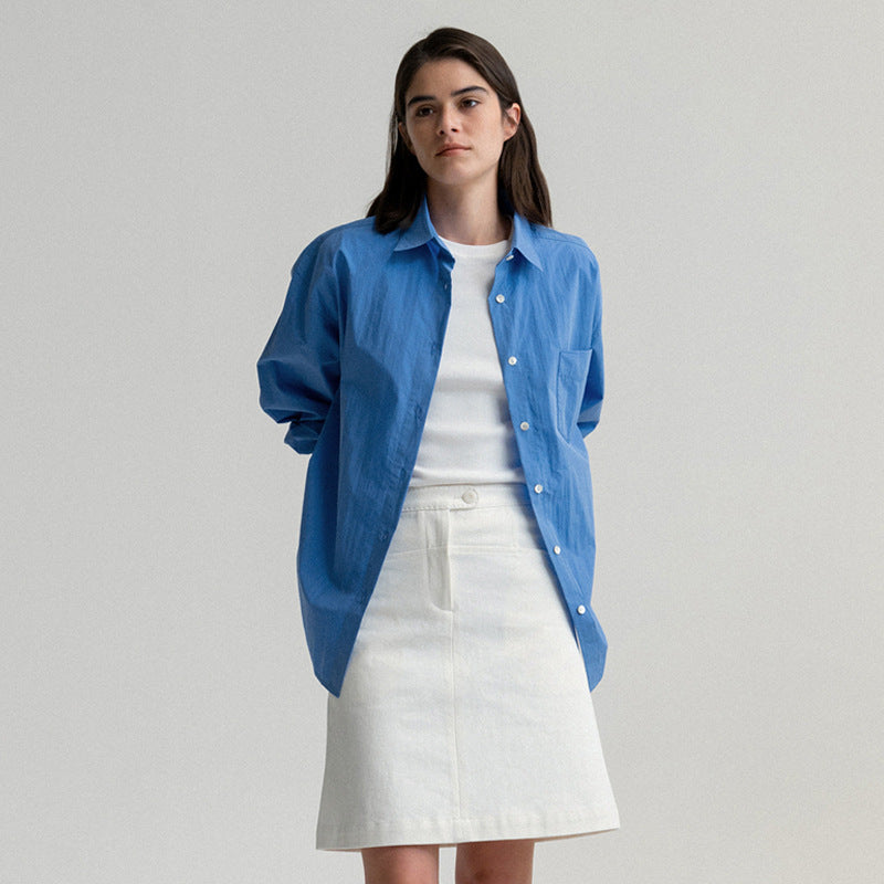 Dame oversized bomuldsbluse med afslappet snit og brystlomme Stilla