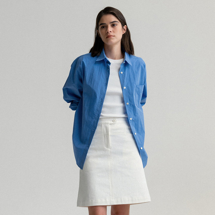 Dame oversized bomuldsbluse med afslappet snit og brystlomme Stilla