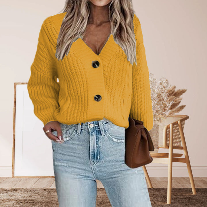 Kvindernes chunky strikket cardigan med knapdetaljer og voluminøse ærmer Stilla