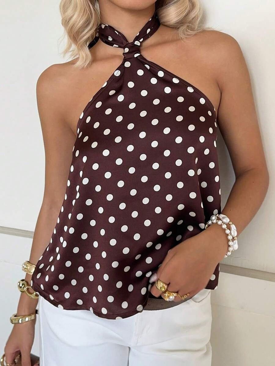 Dame Elegant top med et off-shoulder design og legende prikkemønster Skovae