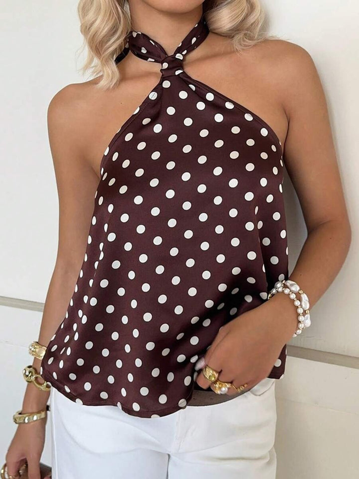 Dame Elegant top med et off-shoulder design og legende prikkemønster Skovae