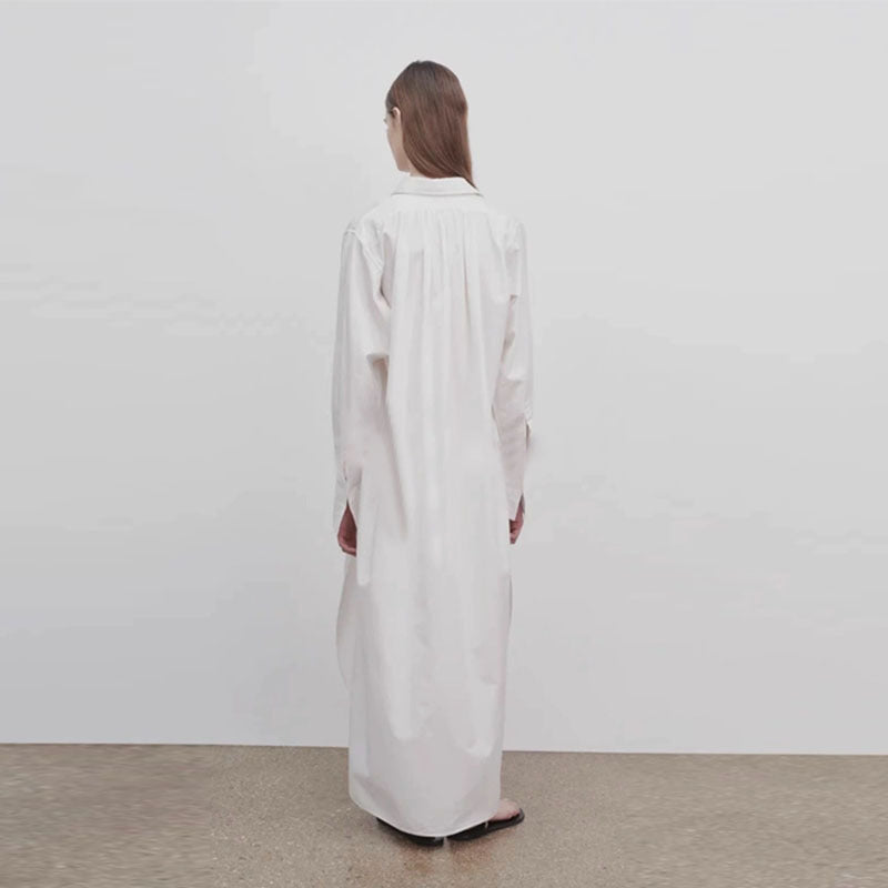 Dame langærmet skjorte med elegant knaplås og asymmetrisk kant Stilla