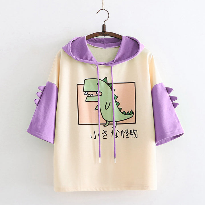 Dame Hoodie-T-shirt med spændende dino-design og stilige 3D-rugfløjter Stilla