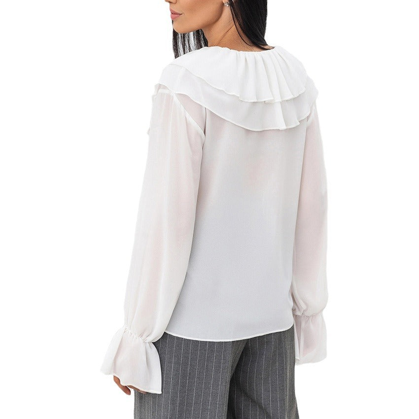 Damebluse med volantdesign og glitrende ærmer Stilla