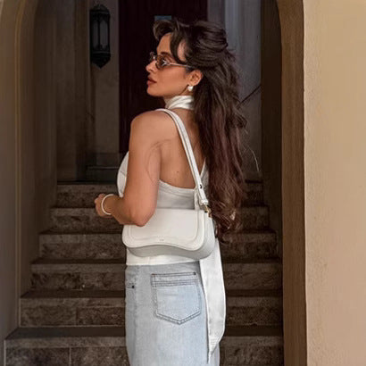 Dame Satin-top med elegant halterdesign og legende sløjfeaccent Stilla
