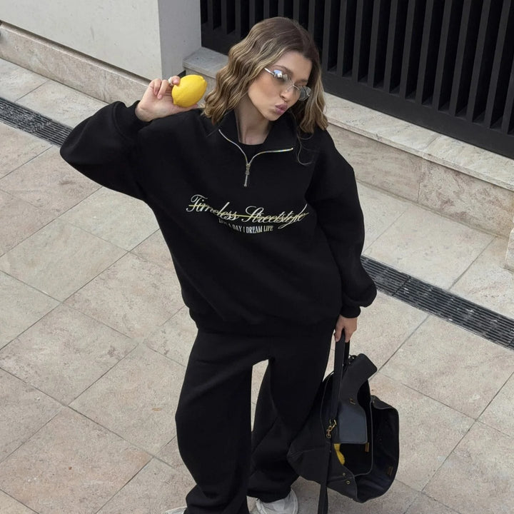 Kvindernes sporty halvlange pullover med fuldlængde lynlås og oversized pasform