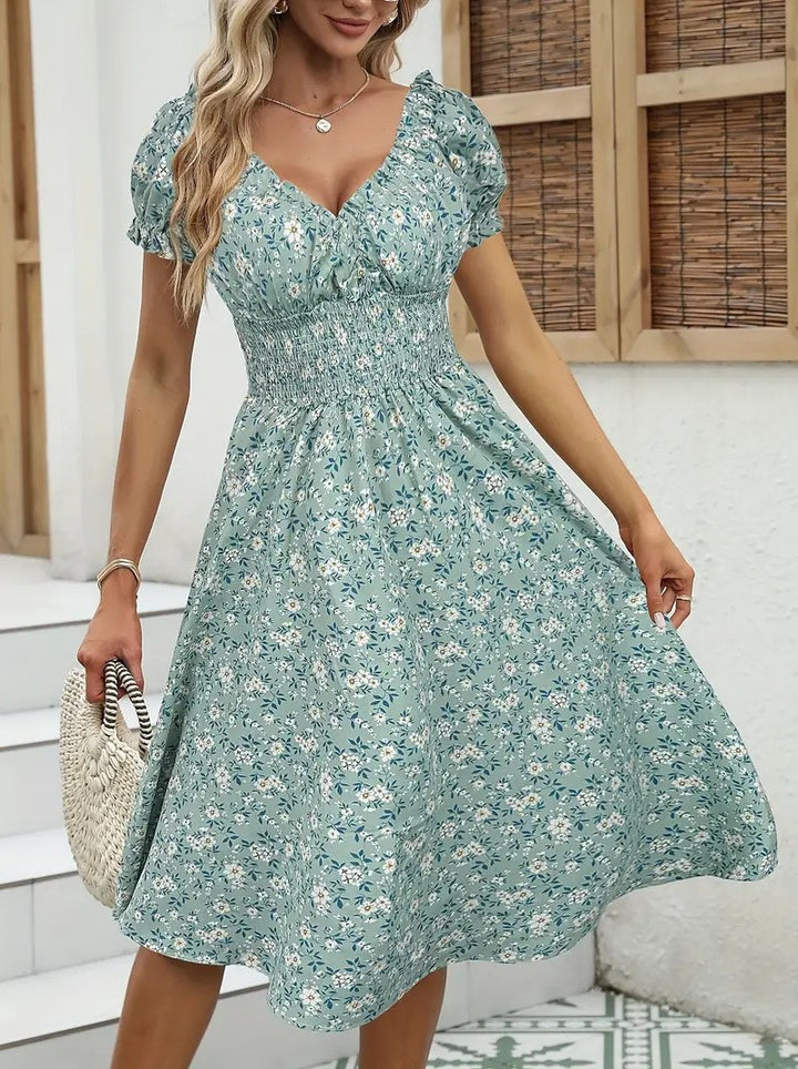 Dame Floral Midi-Kjole med elastisk Talje og Puffærmer Stilla