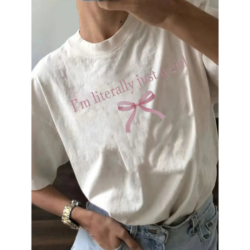 Dame T-shirt med sødt sløjfedesign og inspirerende citat Stilla