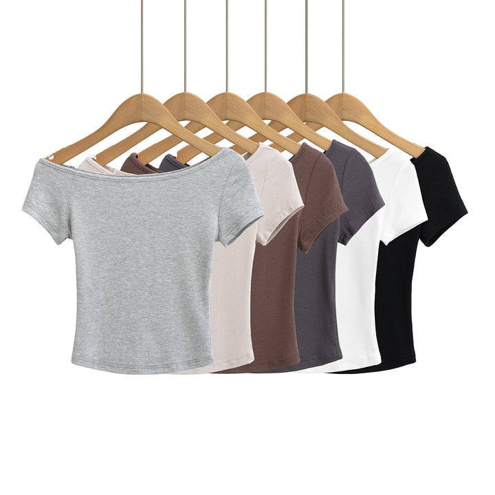 Dame afslappet top med off-shoulder design og struktureret stof Stilla