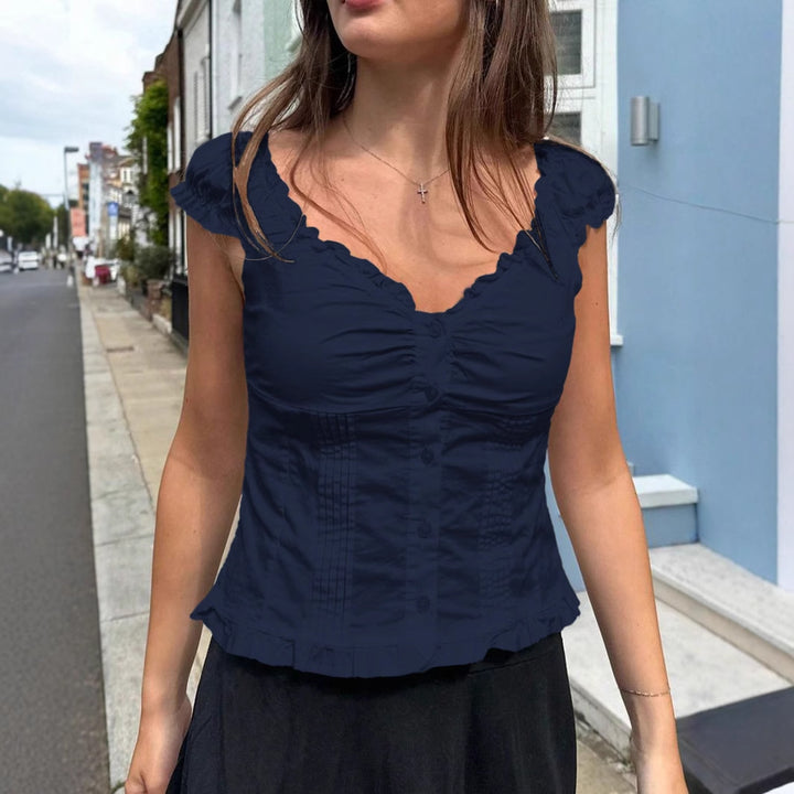 Damebluse med flæser og knaplukning Stilla