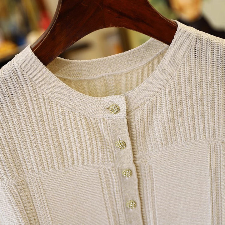 Dame strikbluse med struktureret design og praktiske lommer Stilla