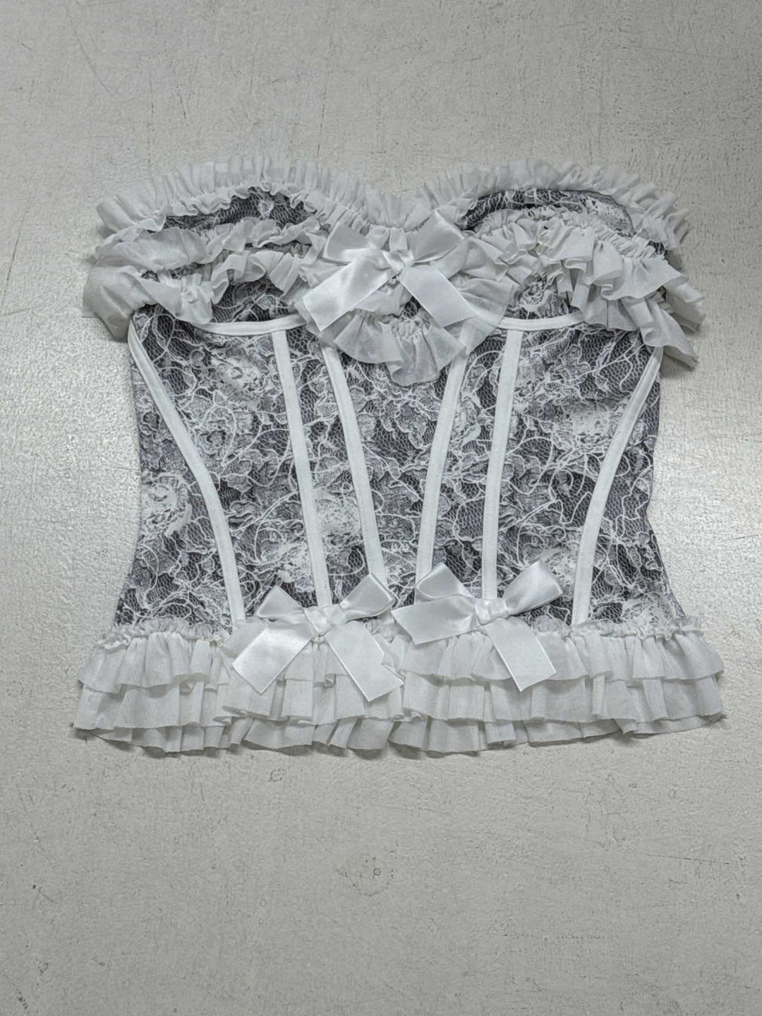 Dame spids-bustier med ruffles detaljer og sløjfer Skovae