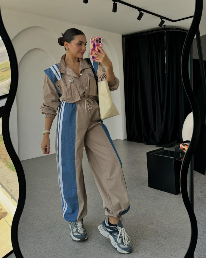 Dame sporty jumpsuit med sofistikeret snoreliv og kontraststriber Stilla