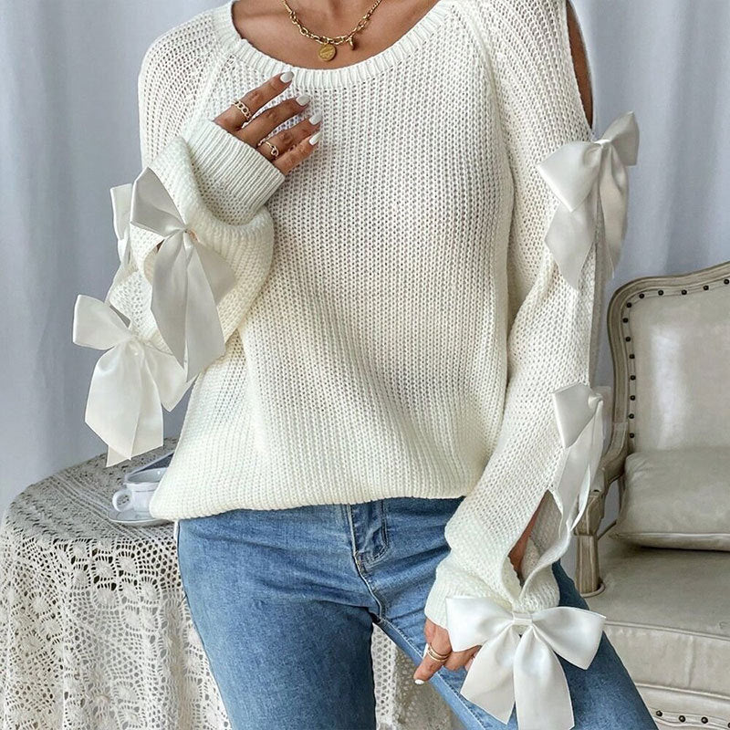 Kvinders strikket sweater med dekorative bue detaljer og åbent ærme design Stilla
