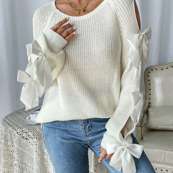Kvinders strikket sweater med dekorative bue detaljer og åbent ærme design Stilla