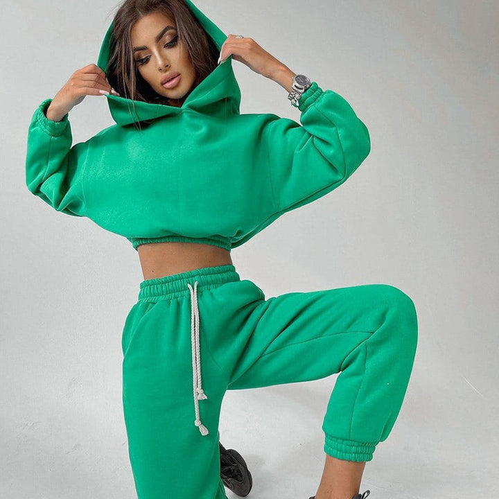 Kvinders sporty cropped sweat sæt med elastisk talje og praktiske lommer