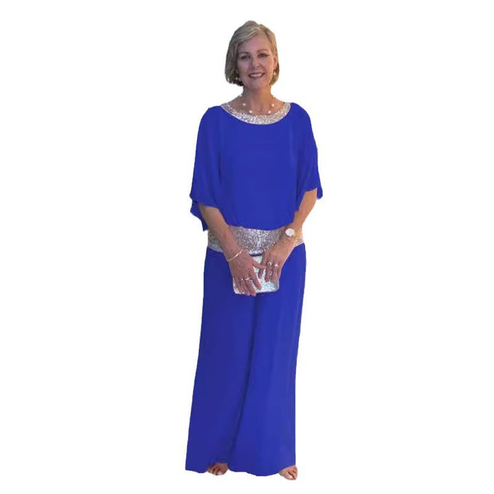 Dame elegant jumpsuit med flydende overdel og glitrende taljebånd Stiila