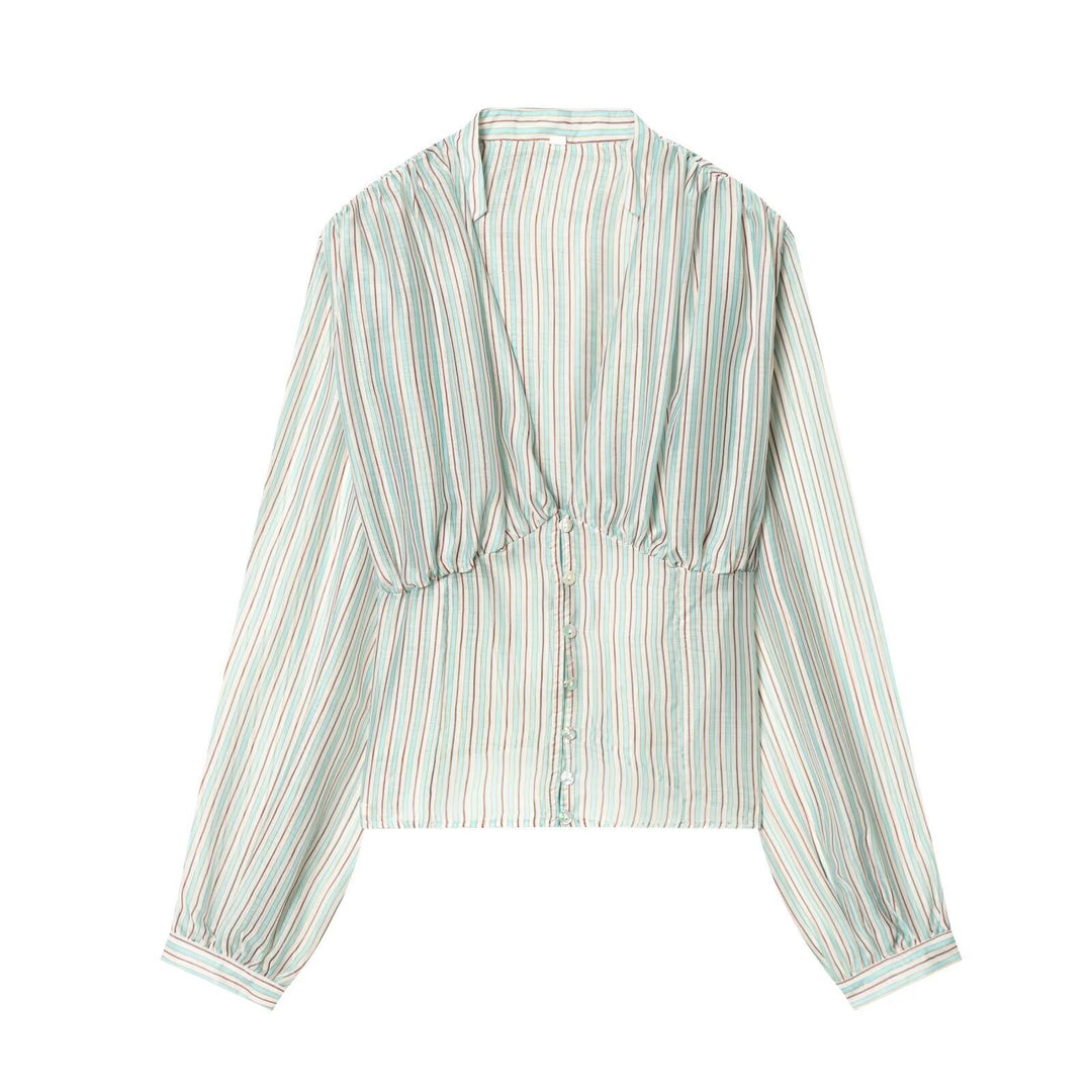 Damebluse med dyb V-udskæring og elegante ruffles detaljer Skovae