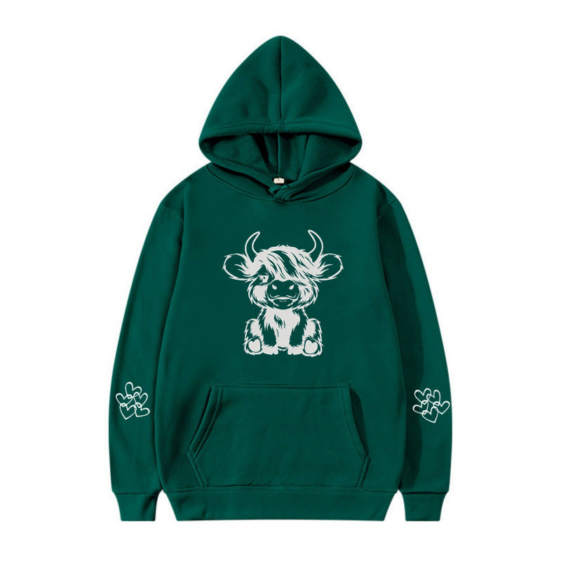 Kvindernes hætte sweatshirt med charmerende kvægmotiv og praktiske kængurulommer Skovae