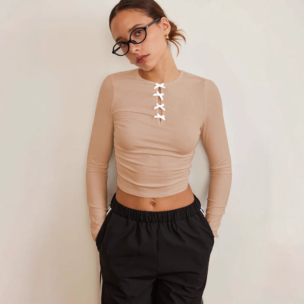 Dame langærmet crop-top med dekorativ knapdetalje Stilla