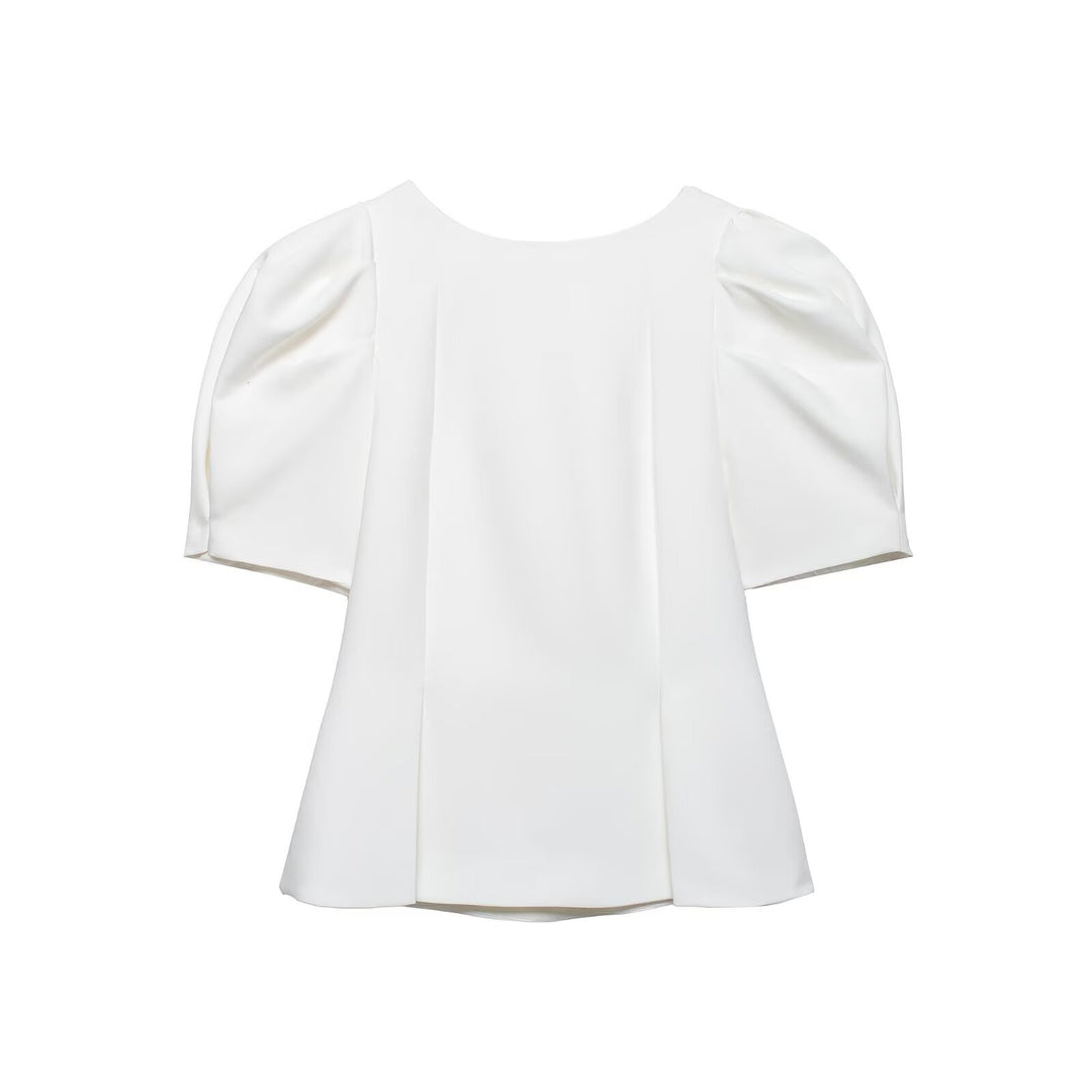 Damebluse med puffærmer og elegant snit Skovae
