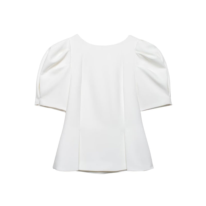 Damebluse med puffærmer og elegant snit Skovae
