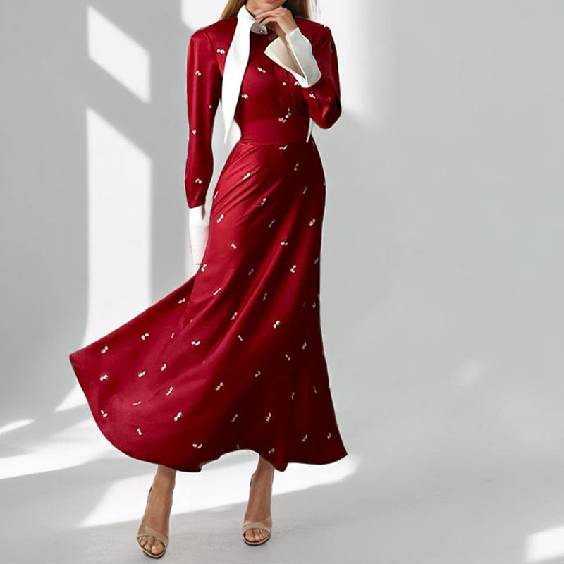 Kvinders elegante maxikjole med kunstnerisk drapering og lange ærmer Stilla