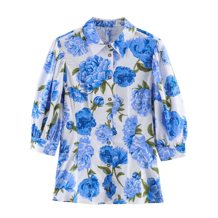 Damebluse med blomstermønster og elegante pufærmer Skovae