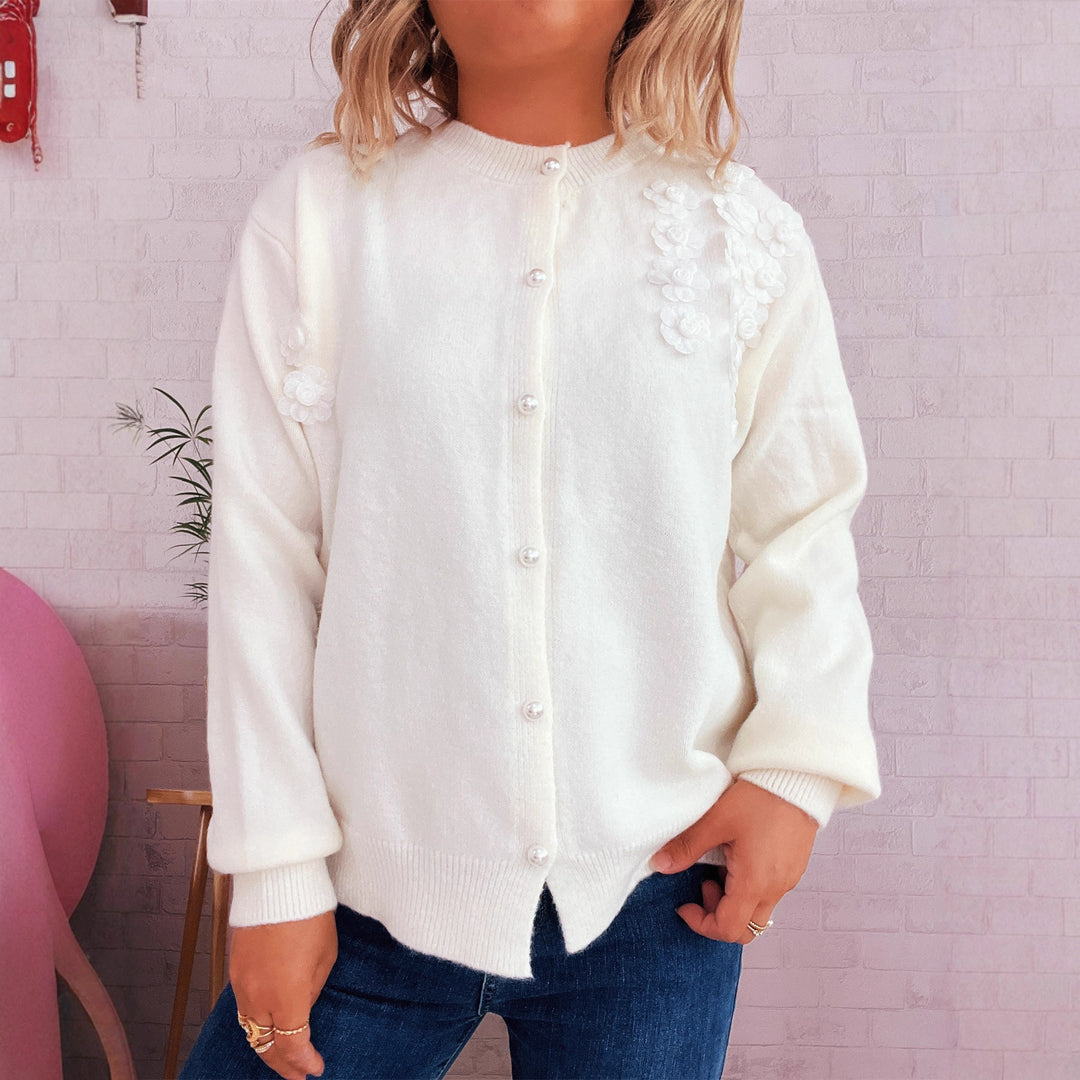 Kvinders cardigan med blomsterapplikationer og knapdetaljer Stilla