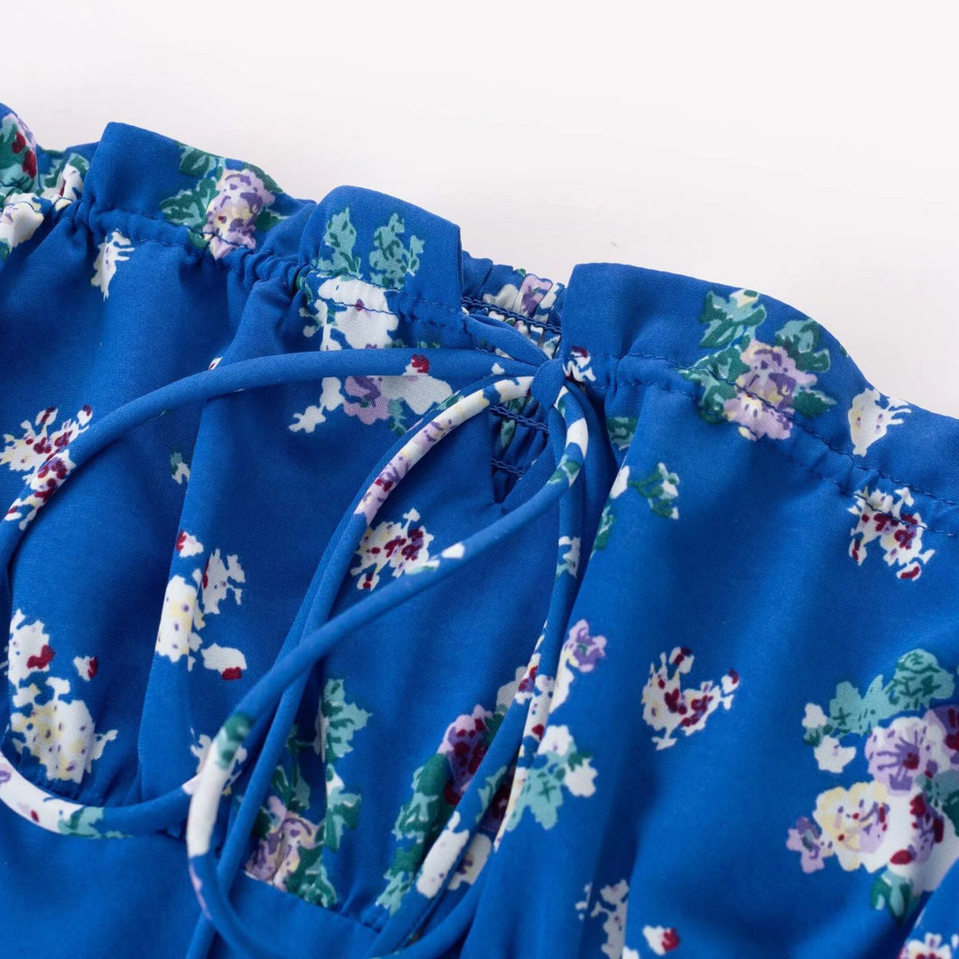 Damebluse med elastiske pufærmer og floralt design Stilla