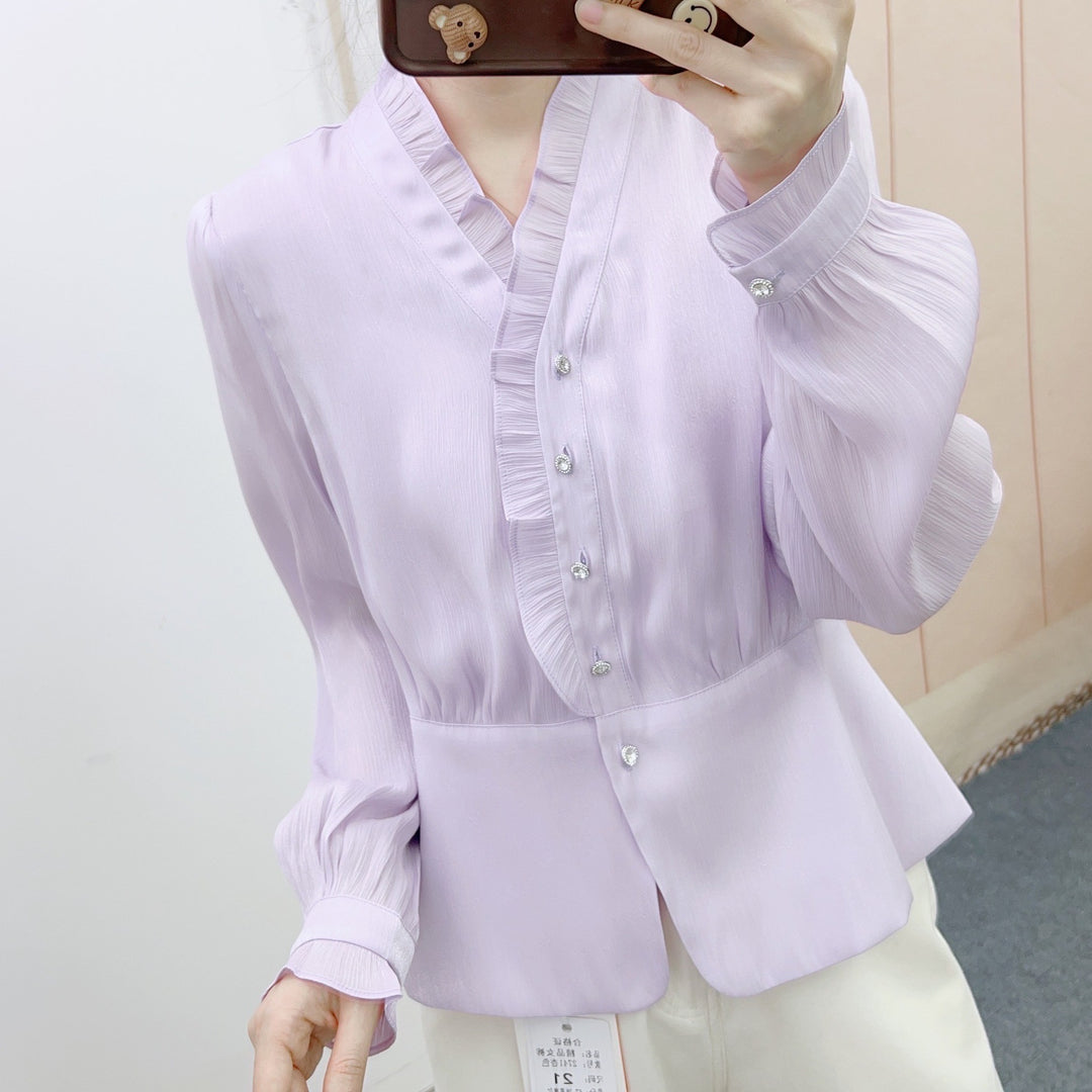 Dame elegant bluse med flæse design og dekorative knapdetaljer Stilla