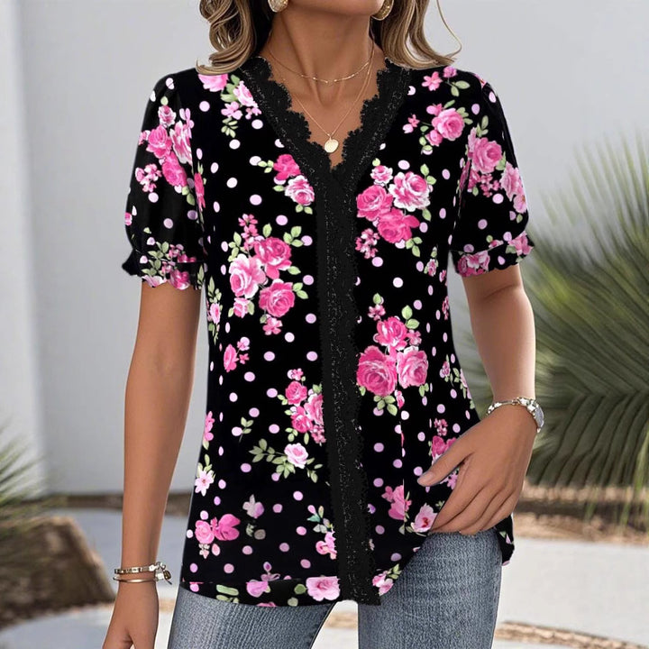 Damebluse med blomsterdesign og raffineret spidsdetalje Stilla