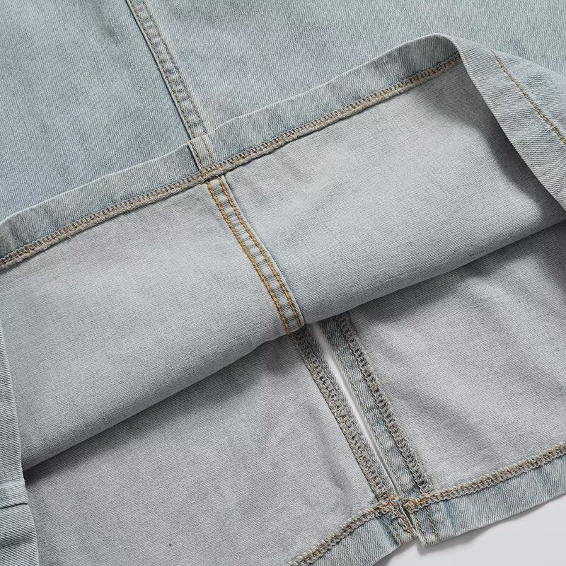 Dame jumperkjole lavet af slidstærk denim med praktiske knapdetaljer og vid udskæring Stilla