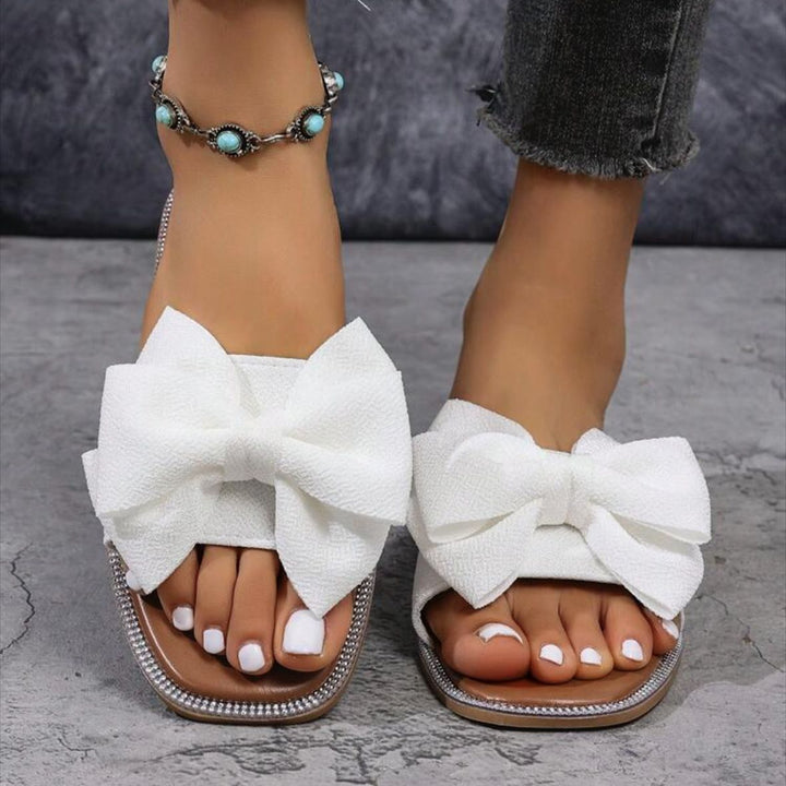 Dame mode slippers med iøjnefaldende sløjfe-design og elegante accenter Stilla