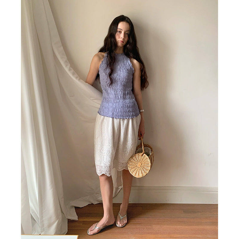 Dame elegant top med smocket look og feminine detaljer Stilla