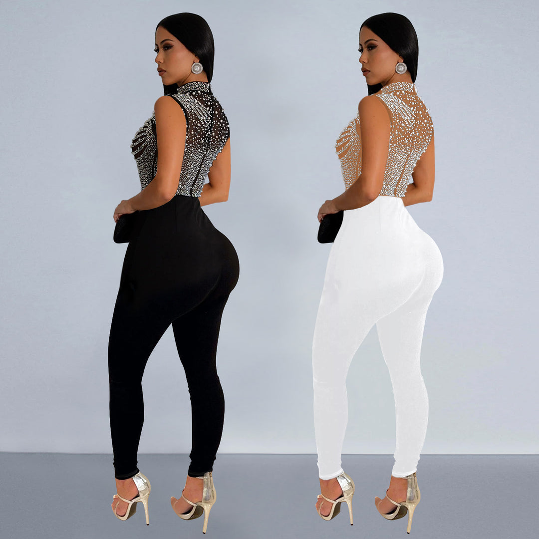 Dame glamorøs jumpsuit med glitrende strassdetaljer og gennemsigtigt overmateriale Stilla